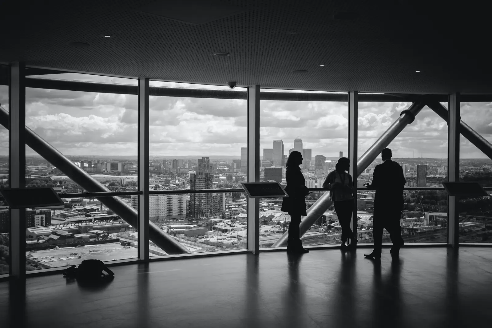 Client and team looking out over the city from a high window